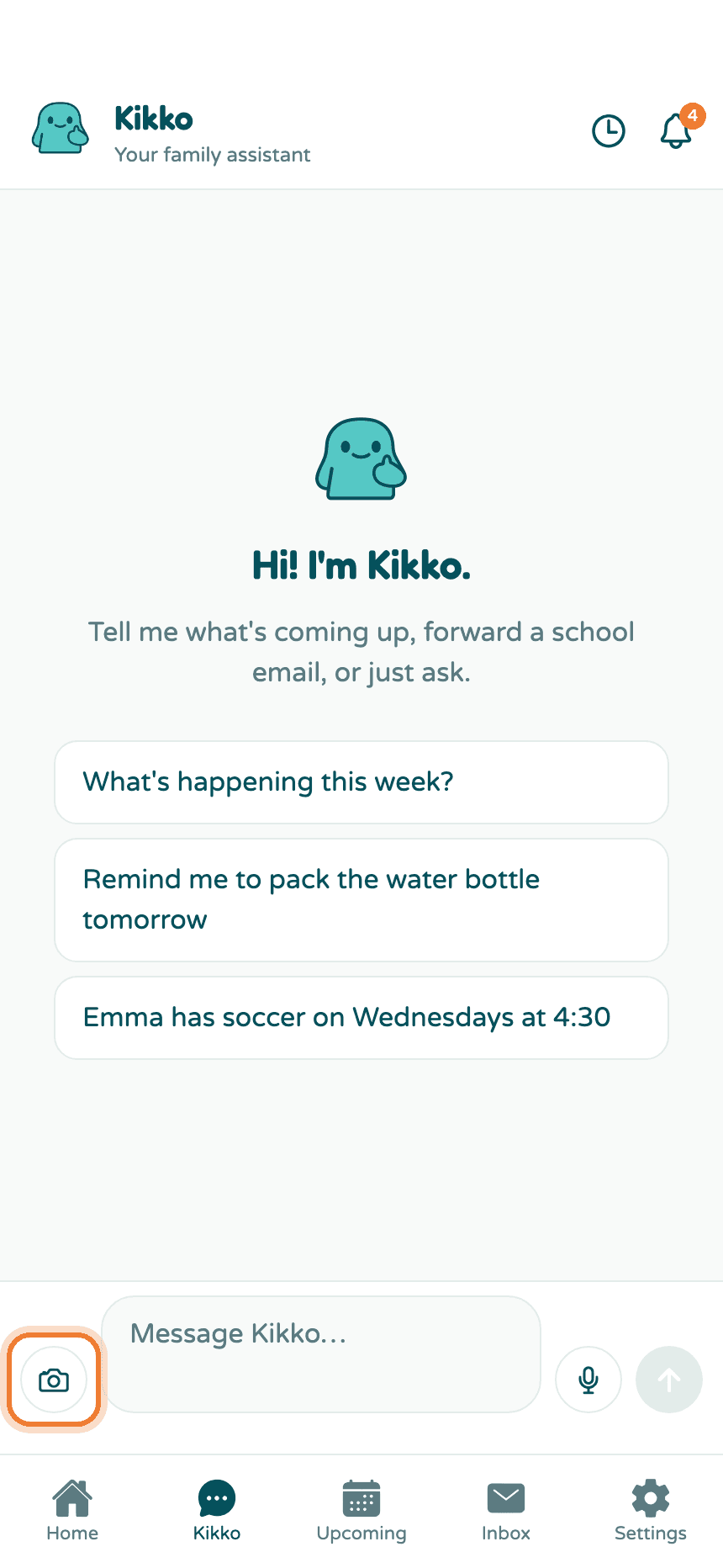 The chat screen with the camera attach button highlighted