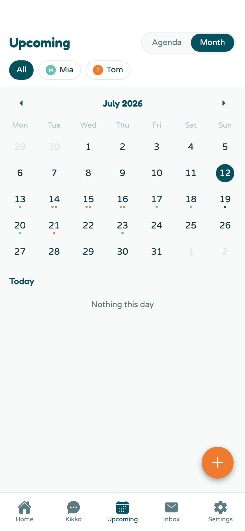 The month grid with colored dots marking which kid has events on each day